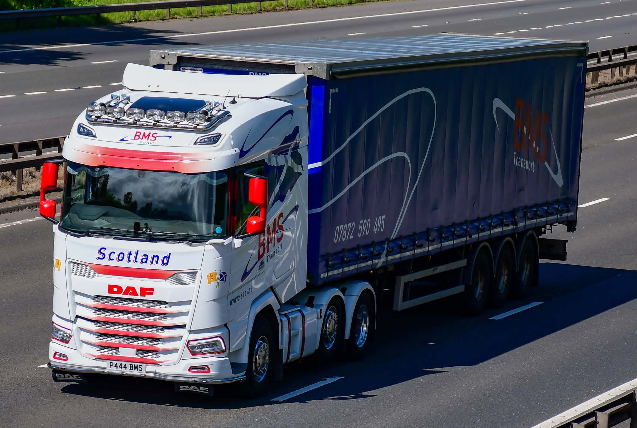BMS Transport truck with curtainsider on the motorway